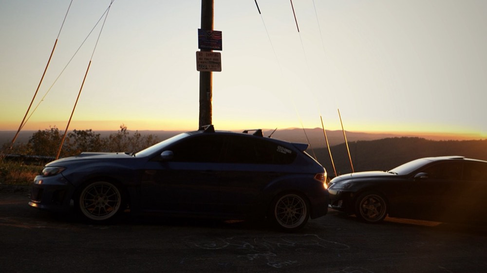 A World Rally Blue Subaru STI at sunset on Burnt Mountain, Georgia